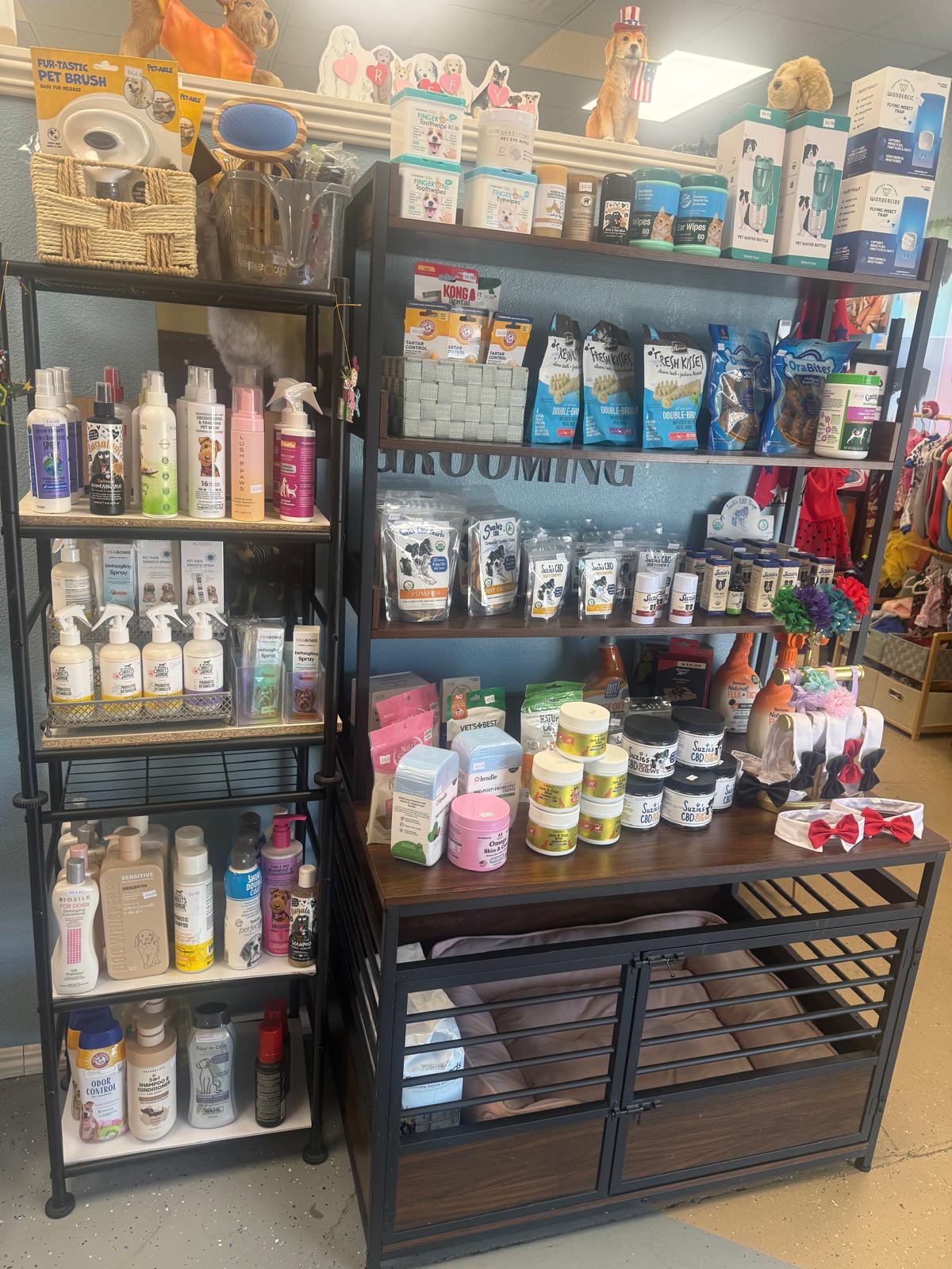Tails Spa boutique shelves stocked with premium pet grooming products, CBD treats, shampoos, and accessories